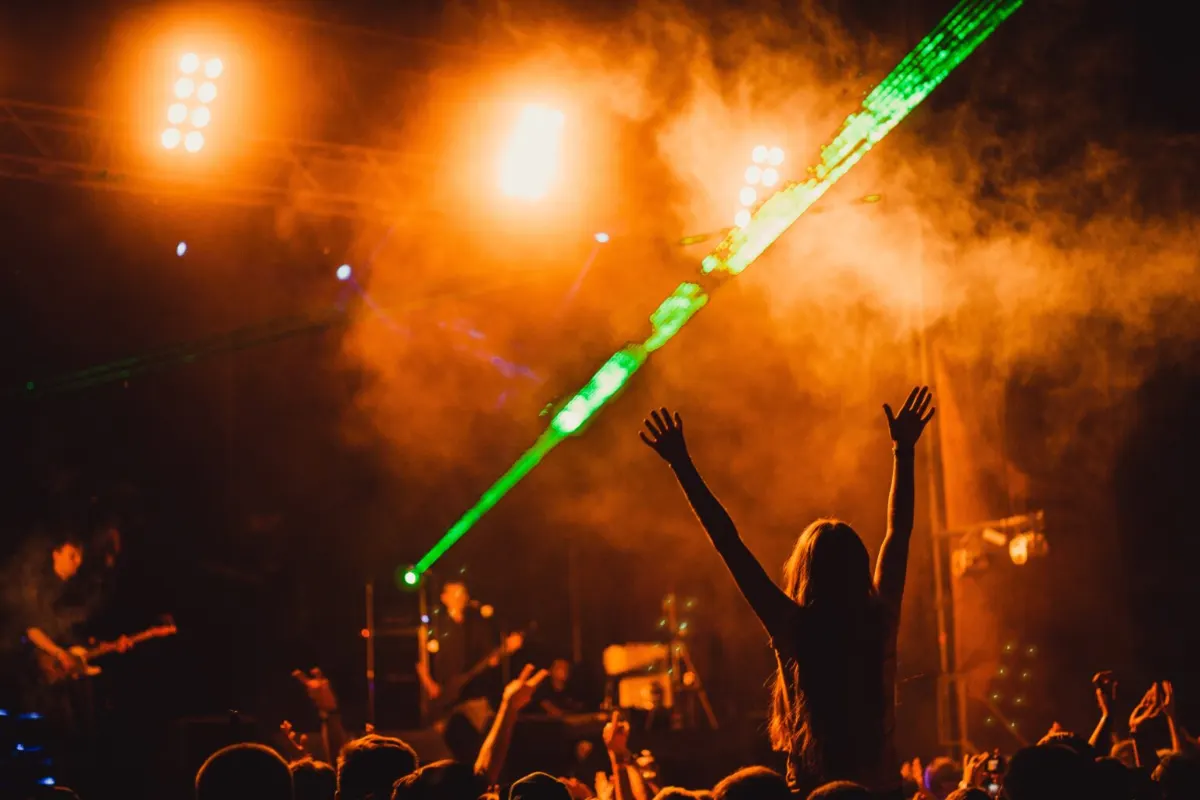 Laser light show over a dancing crowd